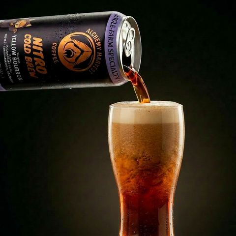 Hand pouring a can of nitro cold brew into a glass with a dark background