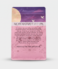 Purple and pink coffee bag with 'AlchemyHarvest.com' text on a beige background