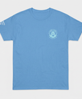 A light blue crewneck t-shirt with a small circular logo on the left chest and white text on the right sleeve, displayed flat against a light gray background.