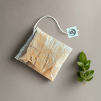 Close-up of Alchemy Steep packaging with origin details and varietals