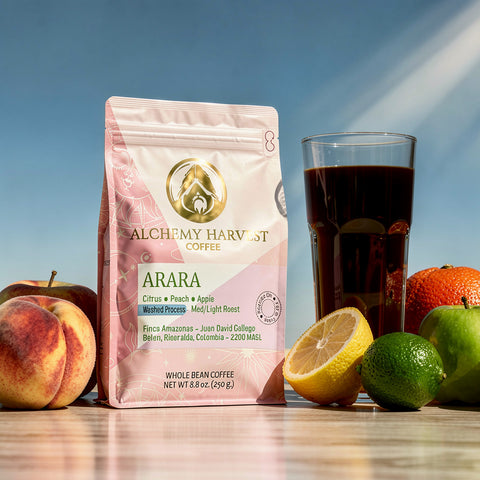 Alchemy Harvest Coffee Arara package with a glass of coffee and fruits on a wooden surface