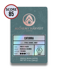Alchemy Harvest coffee bag with cupping score and varietal info visible