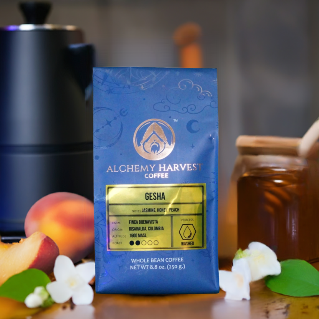 A package of Alchemy Harvest Coffee's Gesha coffee, with visual elements suggesting a mystical theme, placed on a table with peach and greenery accents.