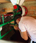 Nelson Urrego milling coffee at Finca Granito de Oro - Alchemy Harvest Coffee